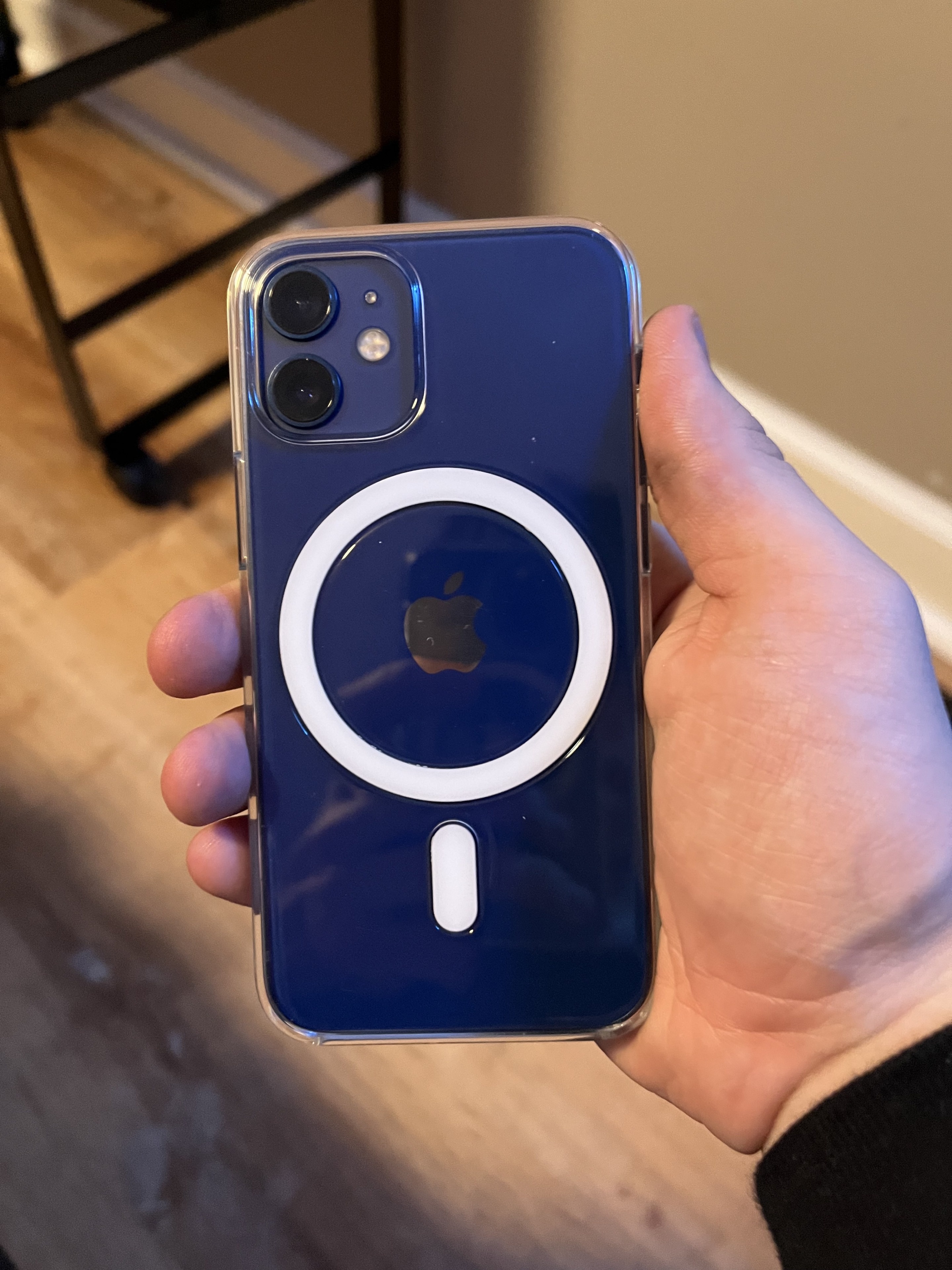 Blue iPhone held in a hand